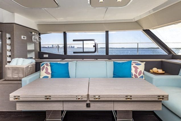 50ft Fountaine Happy Place Miami contemporary lounge with table for entertainment