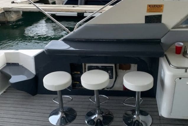 70ft Sea Ray Outrage Miami stylish seating area with table for social gatherings