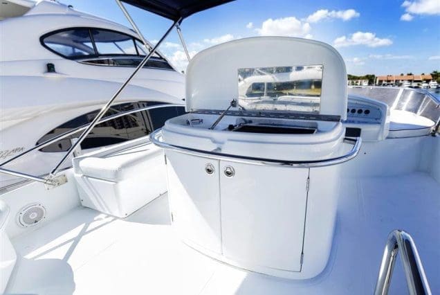 Warrior 65ft Aicon Miami flybridge setup with bbq machine and stylish lounge space