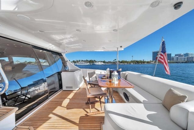 Luxury 70ft Azimut Miami grand boarding area with convenient access to all deck spaces with elegant seating area.