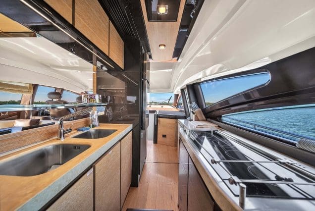 Luxury 70ft Azimut Miami fully equipped galley with premium appliances and modern finishes
