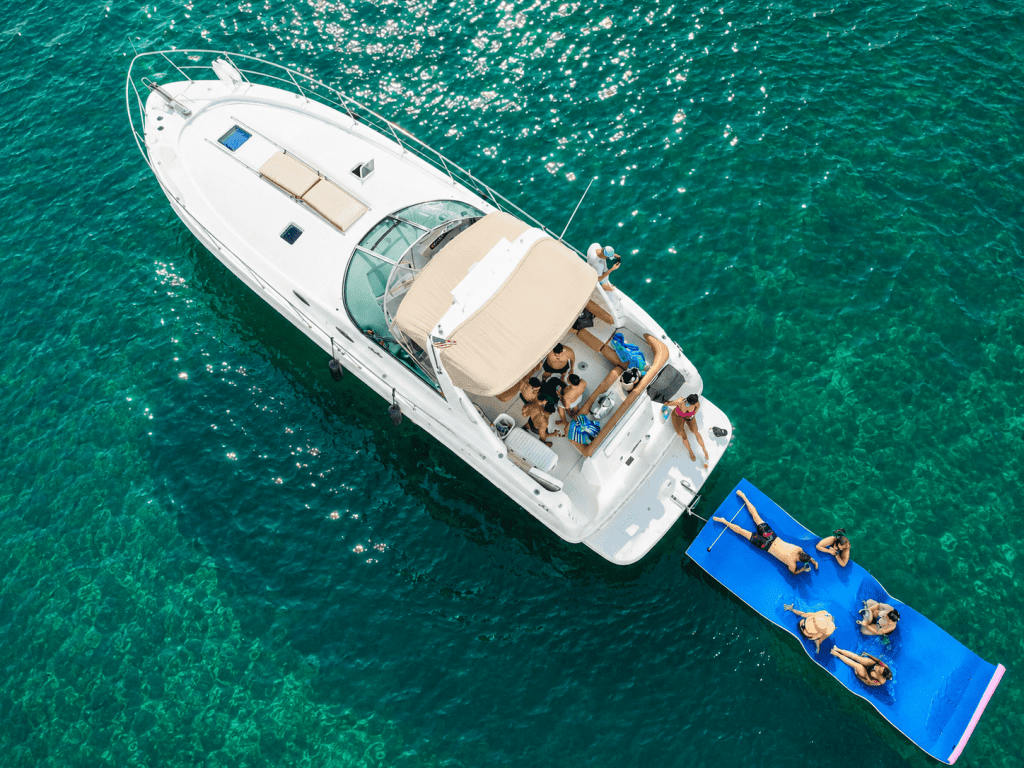 45ft Sea Ray Lux Miami bow lounge area with stunning views of Biscayne Bay and the Miami skyline