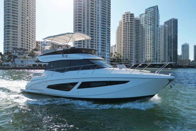 45ft Regal Model 2022 Miami bow lounge area with stunning views of Biscayne Bay and the Miami skyline