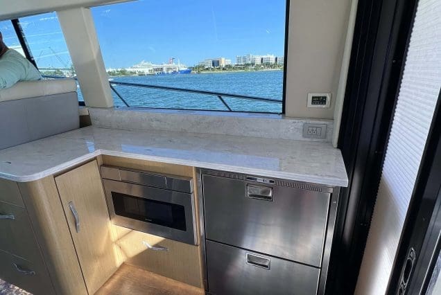 45ft Regal Model 2022 Miami fully equipped galley with modern appliances and premium finishes