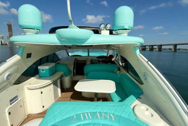 Luxury 60ft Tiffany Sunseeker Miami elevated lounge offering panoramic views of Biscayne Bay and the Miami skyline