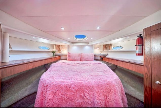 50ft Hello Kitty Pink Yacht Miami guest cabin with stylish pink interiors and comfortable sleeping accommodations
