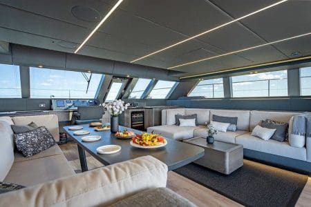 Sunreef 70ft ARCHIPIELAGO Miami luxury lounge with table for refined social gatherings